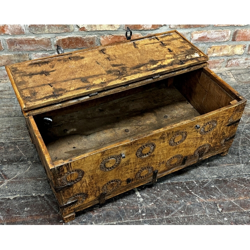 1303 - Indian hardwood and iron box with rising lid and carved medallions, 35 x 80cm