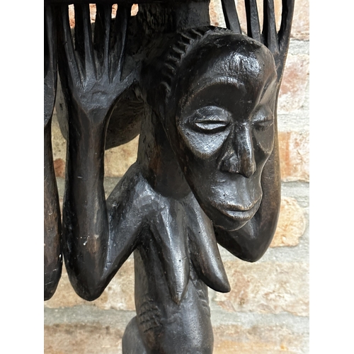 504 - Tribal interest - African caryatid stool, 55cm high