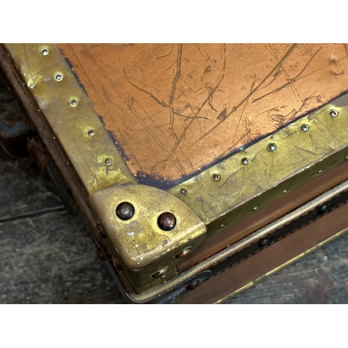 352 - Vintage copper and brass suitcase with studded edges and leather handles, 28 x 64cm