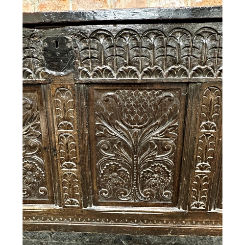 1315 - 18th century panelled oak coffer with four carved floral panels, 76.5 x 159 x 71.5cm