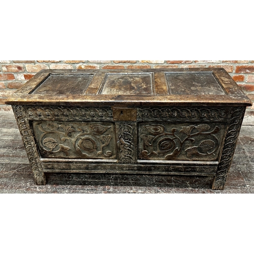 1316 - 18th century oak coffer with two carved floral panels and further carved detail, 65 x 133 x 56cm