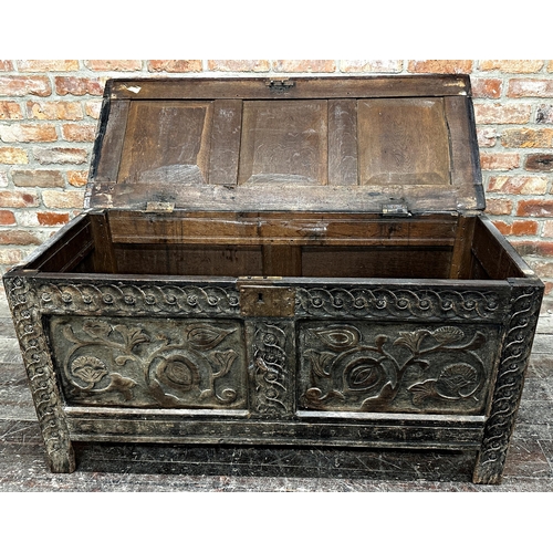 1316 - 18th century oak coffer with two carved floral panels and further carved detail, 65 x 133 x 56cm