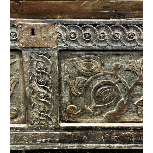 1316 - 18th century oak coffer with two carved floral panels and further carved detail, 65 x 133 x 56cm