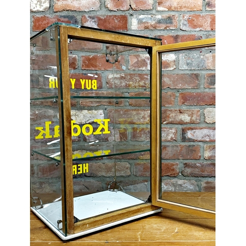 1012 - Good vintage table top glass shop display cabinet inscribed 'buy your Kodak here', 61 x 38cm