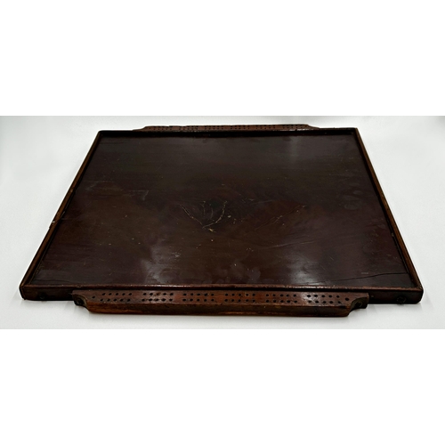 555 - Antique plum pudding mahogany games board with markers to either side, 56cm x 52cm.