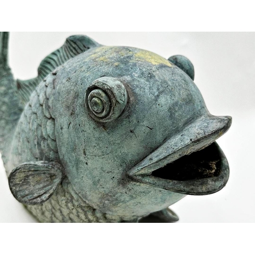 1031 - Patinated cast metal fountain in the form of a fish, 30cm high x 45cm long.