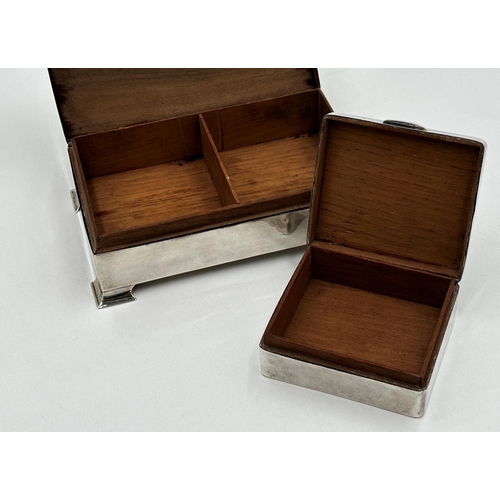 210 - Two silver applied cedar lined cigarette boxes, 17 and 9cm long respectively (2)