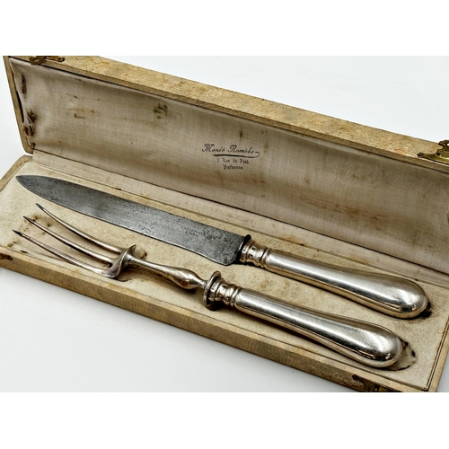 211 - Christofle of Paris silver handled cased carving knife and fork, the knife 33cm long