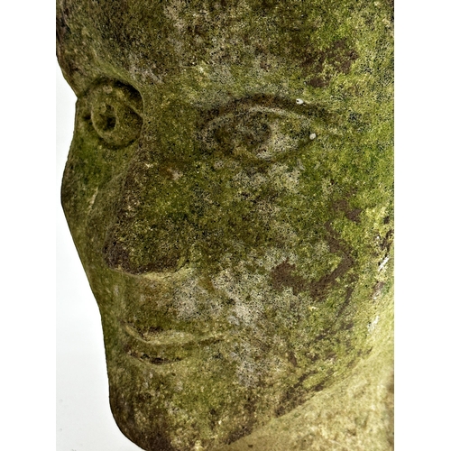 1032 - Antique carved stone head, 27cm high.