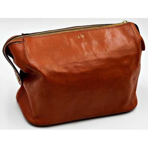 355 - Swaine Adeney Brigg tan leather wash bag featuring gilt metal hardware, hand loop for carrying or ha... 