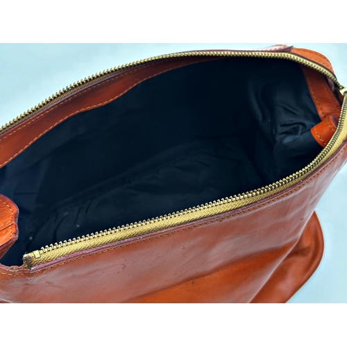 355 - Swaine Adeney Brigg tan leather wash bag featuring gilt metal hardware, hand loop for carrying or ha... 