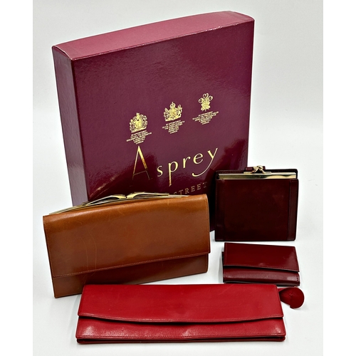 356 - Asprey box containing four leather purses by Asprey comprising longline purse in soft red leather. F... 