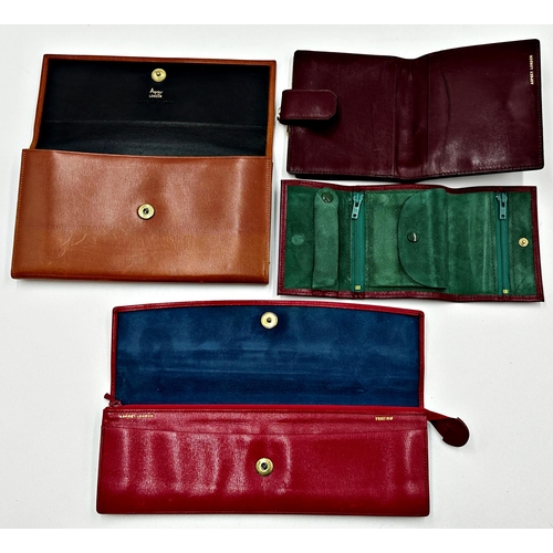 356 - Asprey box containing four leather purses by Asprey comprising longline purse in soft red leather. F... 