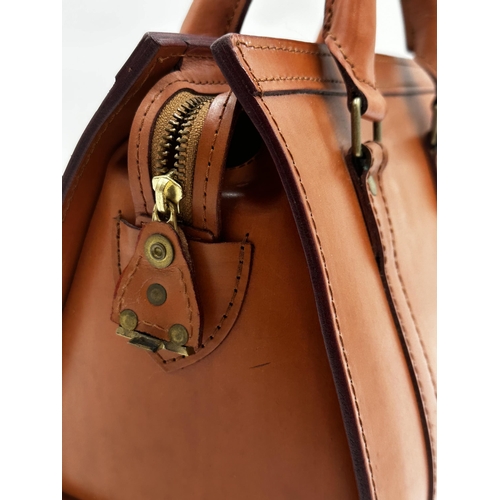 353 - Swaine Adeney Brigg medium sized tan leather tote bag with gold-tone hardware. Features interior zip... 