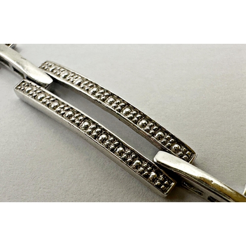 134 - 9ct white gold and illusion set diamond Art Deco style bracelet, 19cm long, 7.8g