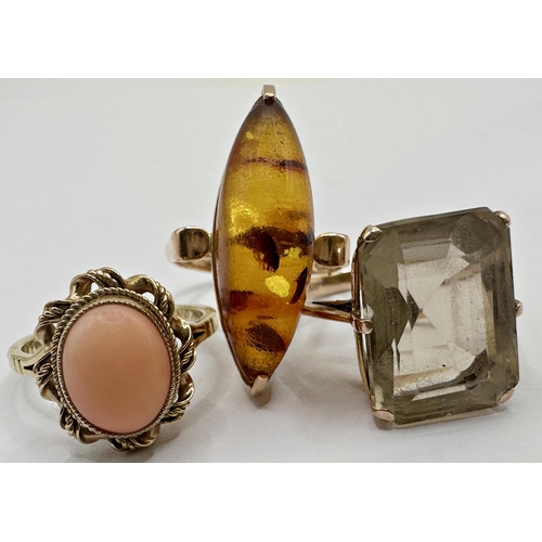 139 - 9ct coral set ring, size L/M, 9ct smoky quartz dress ring, size M/N and a 14ct amber ring, size M, 1... 