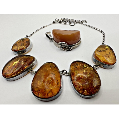 140 - Silver butterscotch amber pendant, 3 x 2.cm (not including bale), 16.1g, with a further silver and a... 