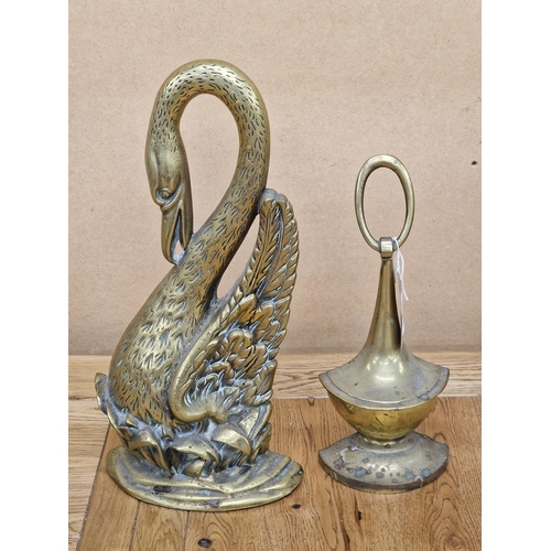 98 - Cast brass swan neck door porter, 38cm high together with a further brass door porter (2)