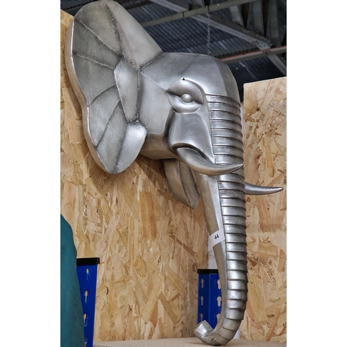 114 - Stylised silvered elephant head wall trophy, 64cm high