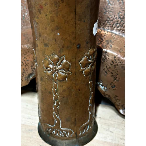 82 - Keswick school Art and Crafts planished copper brush pot with repeating flowered decoration, 19cm hi... 