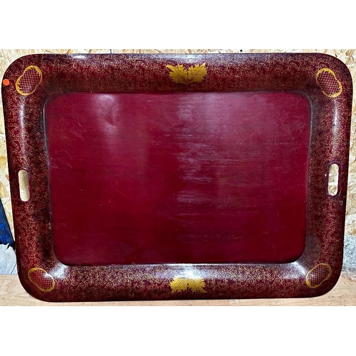 84 - Regency toleware twin handled tray with gilt decoration on a red ground, 55 x 75cm