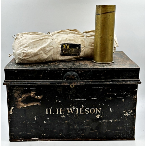 110 - Jappaned tin military trunk inscribed H.H. Wilson, 31 x 51cm, with a trench art shell and campaign b... 