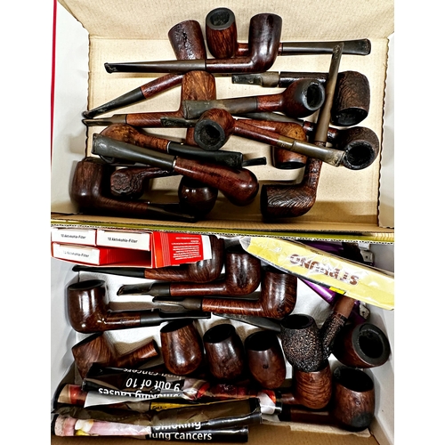 121 - A large collection of vintage pipes and related products