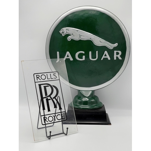 108 - Cast iron Jaguar advertising signage, 52cm high together with a further Rolls Royce Perspex sign (2)