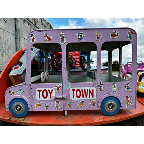 1 - A merry-go-round-style carousel toy vehicle ride funfair attraction featuring cars, a train, motorbi... 