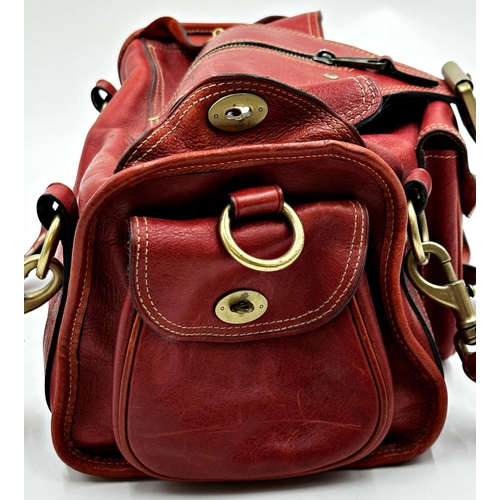 358 - A vintage Mulberry Emmy shoulder bag in oxblood leather.  Gold tone hardware with top flap magnetic ... 