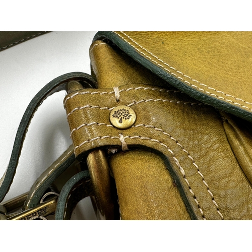 359 - A vintage leather Mulberry handbag in apple green. Gold tone hardware with buckles to the side and f... 