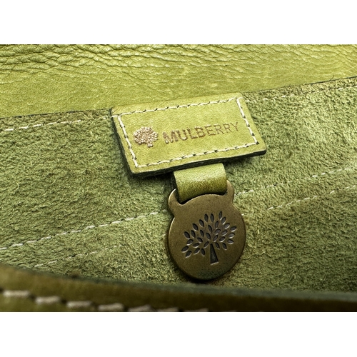 359 - A vintage leather Mulberry handbag in apple green. Gold tone hardware with buckles to the side and f... 