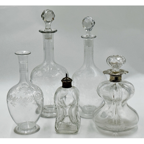 412 - Good silver collared waisted glass decanter of lobed form, 22cm high together with a further glass a... 