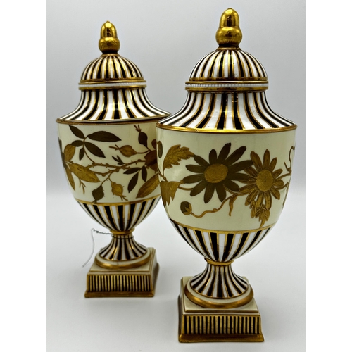 436 - Good quality pair of Wedgwood porcelain lidded urns, with gilt acorn finials and floral band, 26cm h... 