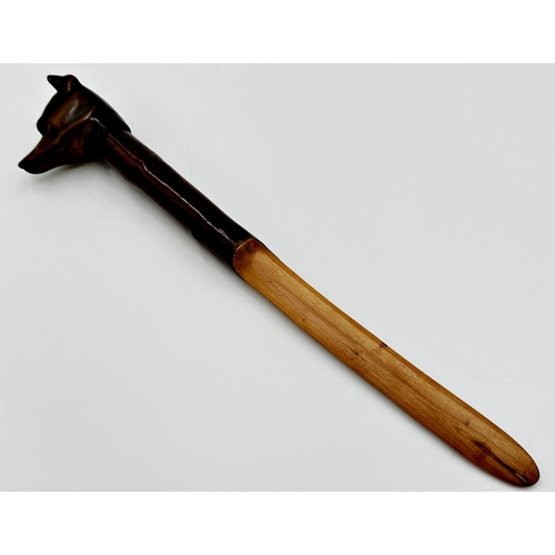 561 - Swaine & Adeney quality carved hound head letter opener/page turner, with glass eyes, 34cm long