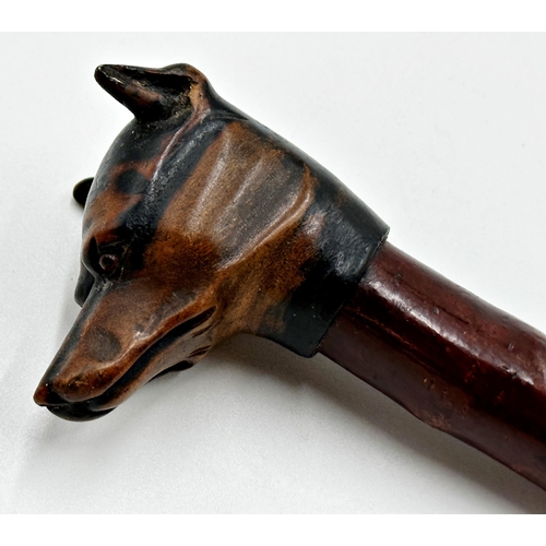 561 - Swaine & Adeney quality carved hound head letter opener/page turner, with glass eyes, 34cm long