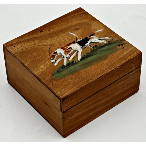 563 - Early 20th century walnut box, the hinged lid hand painted with two fox hounds, monogrammed, 6cm hig... 