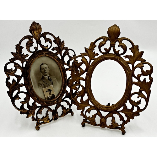 619 - Pair of rococo gilt cast metal easel photographic frames, with oval mounts and pierced with scrolled... 