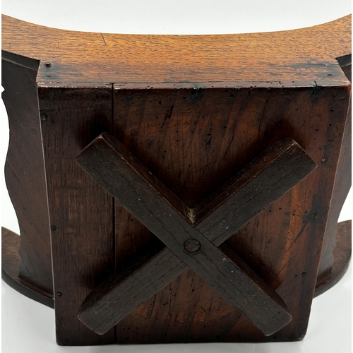 576 - 19th century country oak cheese coaster upon an unusual revolving base, 44cm long