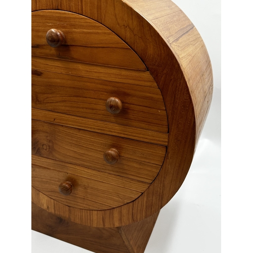 573 - Mid 20th century satinwood table top cabinet of circular form, fitted with four shaped drawers upon ... 