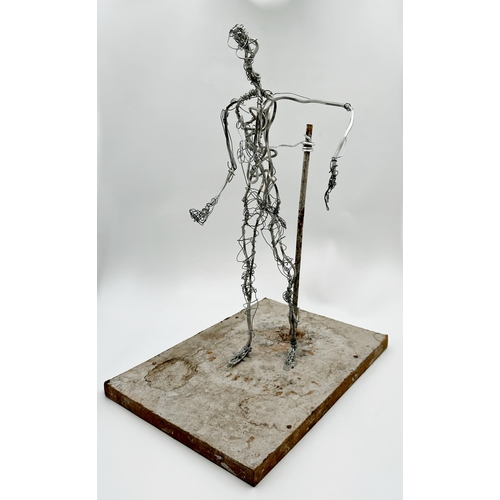 1254 - Unusual figural wirework sculpture upon a plinth base, 53cm high.