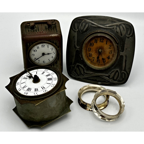 372 - Mixed lot comprising an Archibald Knox style pewter cabinet clock, a further cabinet clock, a French... 