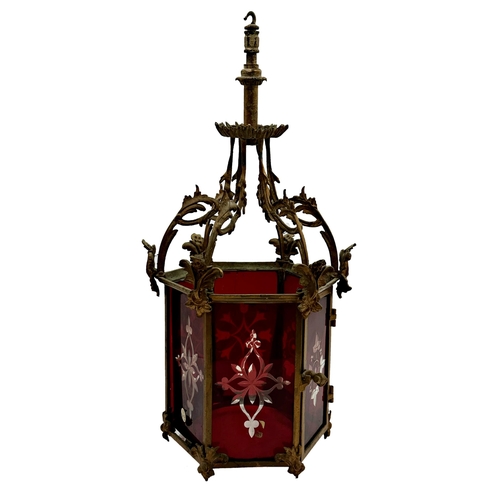 1182 - 19th century hexagonal hall hanging lantern, with scrolled rococo type frame fitted with six cranber... 