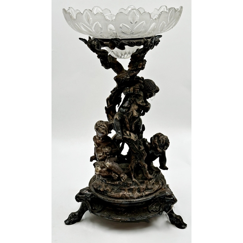 327 - Impressive silver plated centrepiece with original glass bowl over a column modelled as three playfu... 