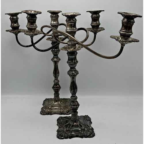 332 - Large collection of silver plated candlesticks mostly in pairs together with a pair of candelabra an... 