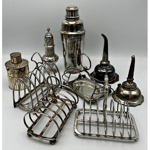 338 - Collection of silver plated items to include three toast racks, two antique wine funnels, a wrythen ... 