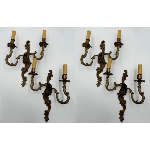 1180 - Set of four gilt metal twin branch rococo wall lights, 45cm high (4)