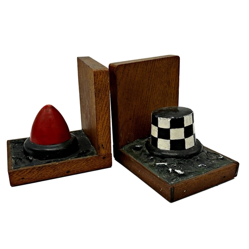 587 - Pair of novelty oak bookends each carved with a lifebuoy, 16cm high x 16cm deep (2)