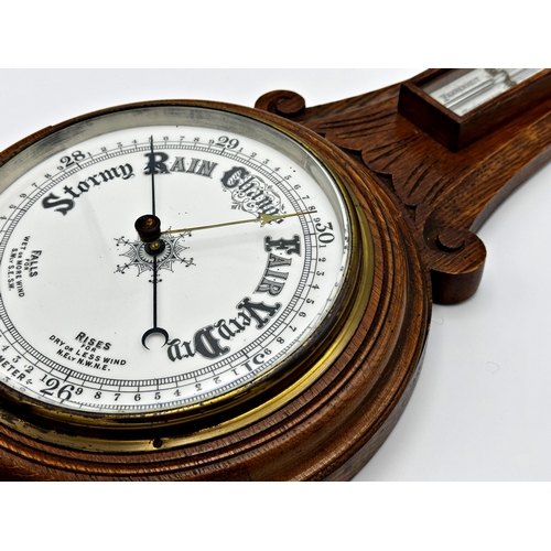 73 - Oak aneroid barometer with mercury thermometer, 91cm high