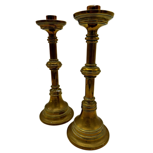 636 - Pair of ecclesiastical brass candlesticks, 33cm high (2)